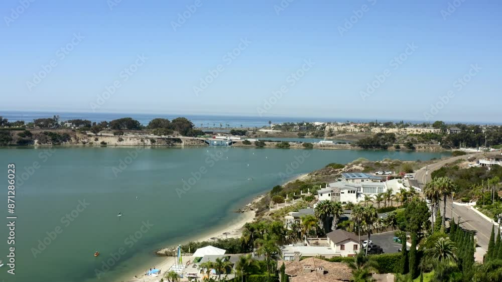Aerial view Carlsbad Batiquitos Lagoon and bridge crossing on a sunny day in San Diego California with blue sky and wetlands by the Pacific Ocean off highway 101 Aerial view Carlsbad Batiquitos Lagoon and bridge crossing on a sunny day in San Diego California with blue sky and wetlands by the Pacific Ocean off highway 101