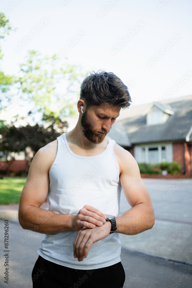 A man uses an electronic watch A man uses an electronic watch