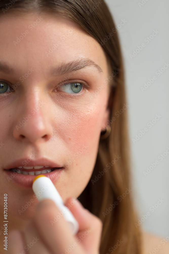 Applying lip balm