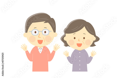 笑顔で両手を挙げるシニア夫婦
