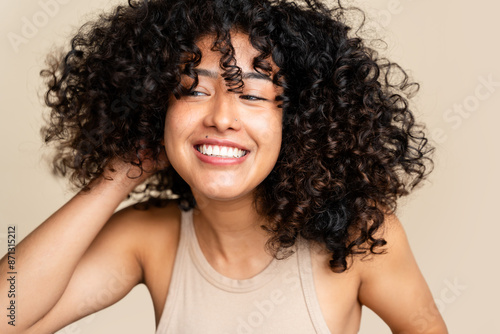 Radiant smile - joyful woman with curly hair