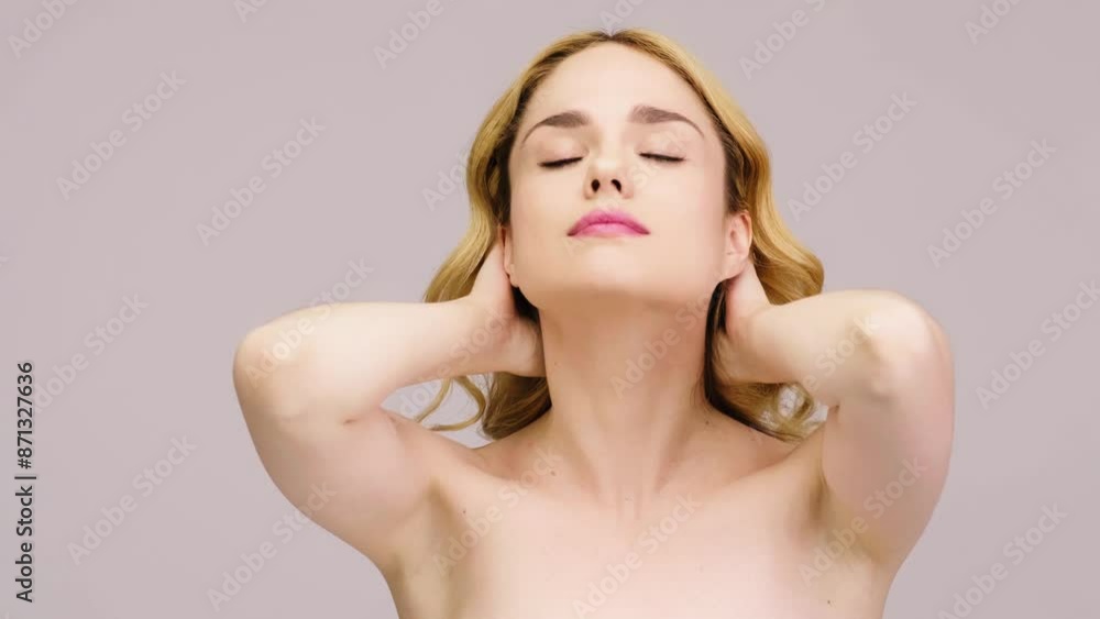 Charming blonde posing against a light background. Concept of health, cosmetology and beauty Charming blonde posing against a light background. Concept of health, cosmetology and beauty
