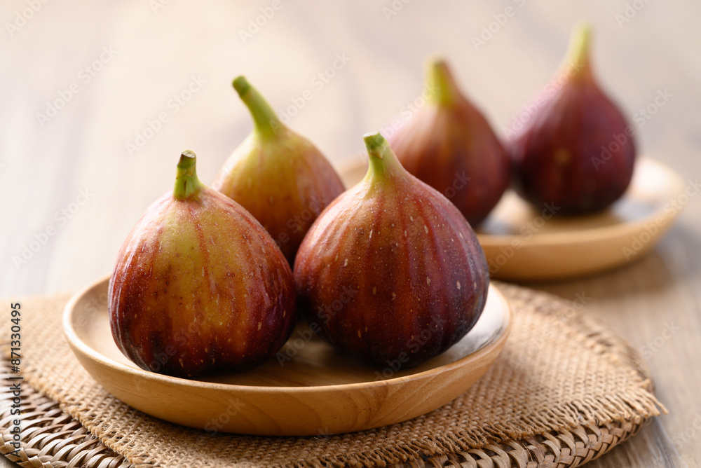 Fresh fig on wooden plate, Healthy fruit Fresh fig on wooden plate, Healthy fruit