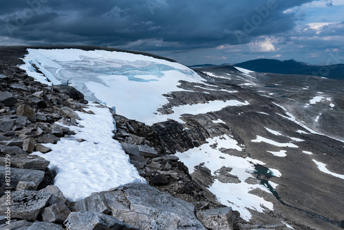 View from Bolnatind, on the arctic circle in Helgeland, Norway. Cloudy day in the norwegian fjell. High resolution panoramas of saltfjellet and Svartisen Nasjonalpark. Glacier and mountains photo