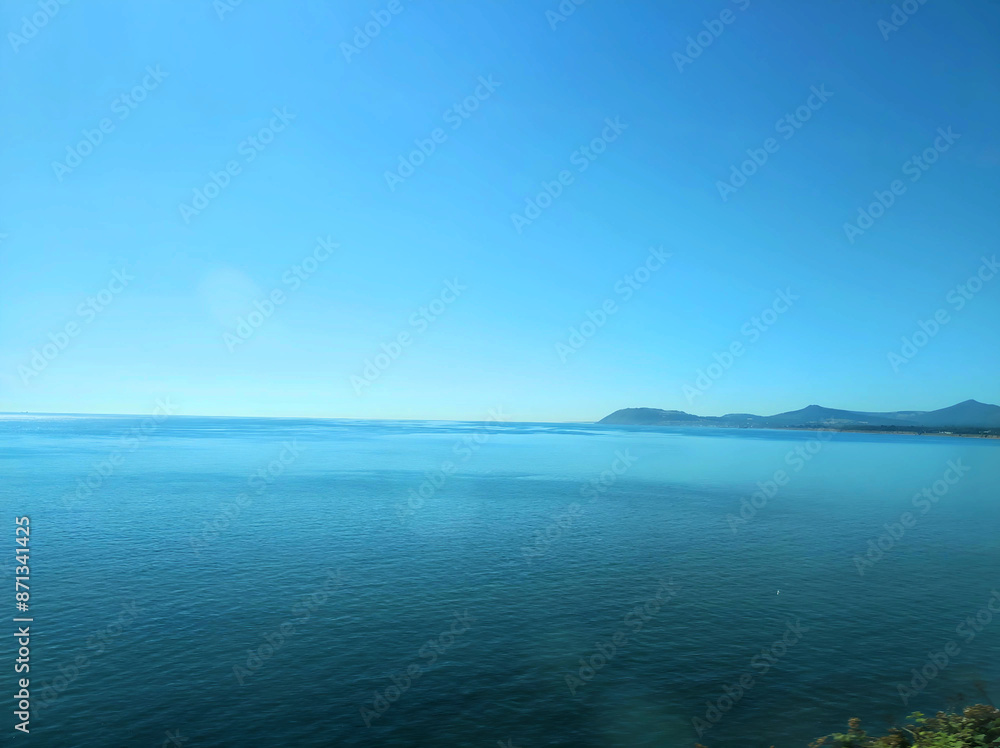 Obraz premium view of the sea and mountains from the train