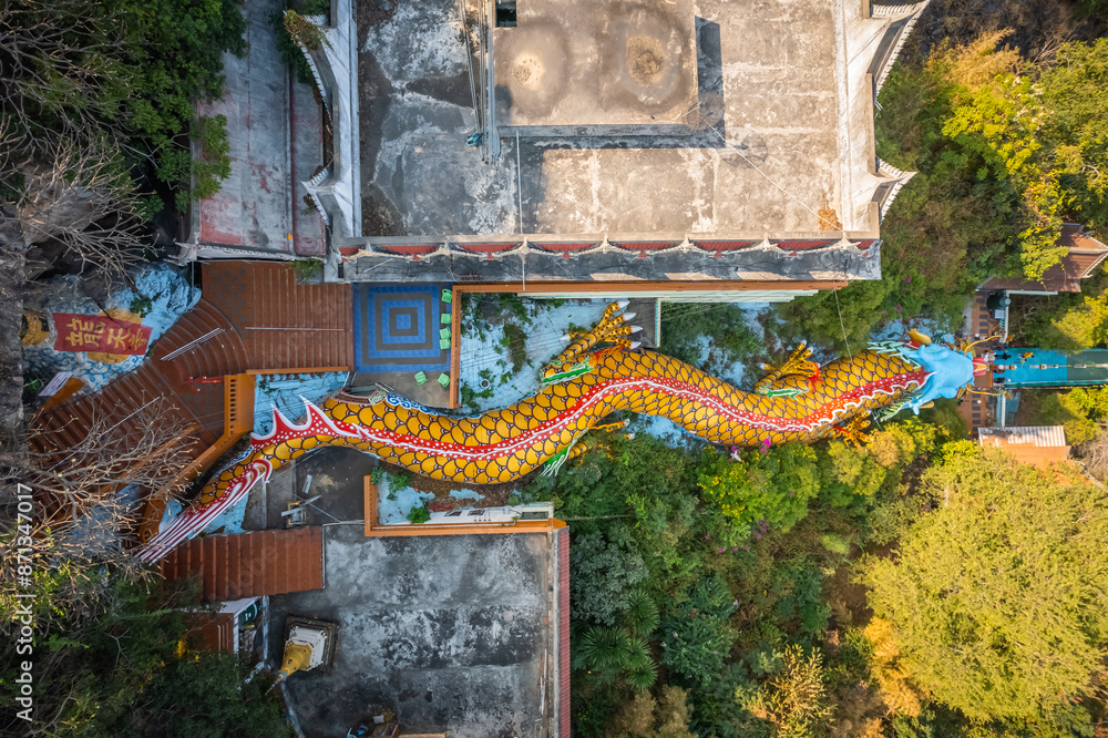 Obraz premium Top view of the large dragon statue on the mountain, and inside the dragon is a tunnel for going up to the cave at Wat Ban Tham, Kanchanaburi, Thailand