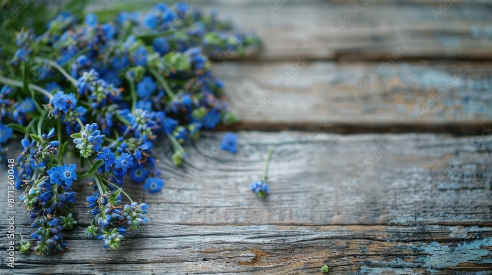 Obraz premium Blue wildflowers bouquet on weathered wood Rustic living Close up Focused Spacious area