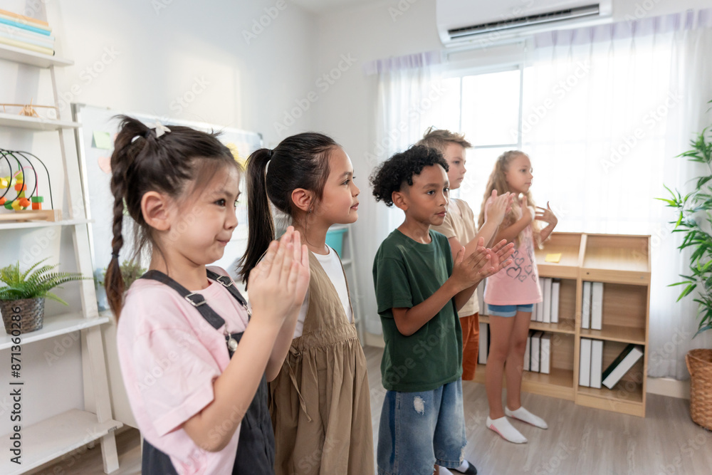 Group of diversity adorable student clapping hands at nursery school. Group of diversity adorable student clapping hands at nursery school.