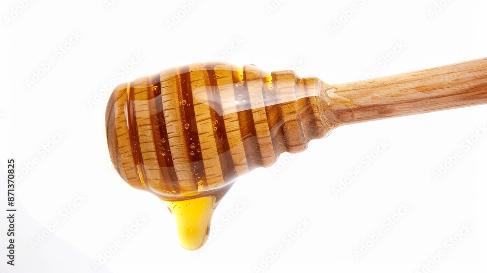 Honey dipper with honey dripping isolated on white background. Close-up. Honey dipper with honey dripping isolated on white background. Close-up.