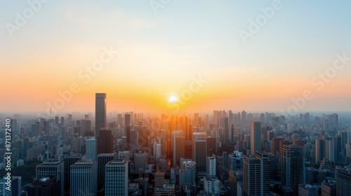 Wallpaper Mural Sunrise Over Expansive Cityscape. Expansive cityscape with the sun rising over the horizon, illuminating tall buildings in a warm morning glow. Torontodigital.ca