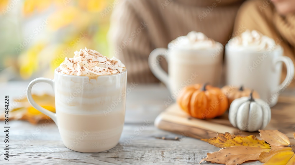 Cozy autumn scene with pumpkin spice latte and mini pumpkins. Cozy autumn scene with pumpkin spice latte and mini pumpkins.