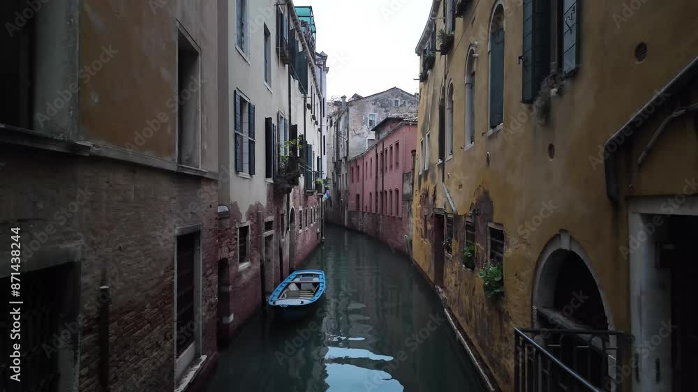 Empty navigable channel in Venice Italy, early morning, locals neighbourhood Empty navigable channel in Venice Italy, early morning, locals neighbourhood