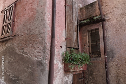 View of some details in an alley in the historic center of Argegno. Lake Como, Italy