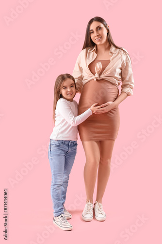 Little girl with her pregna...