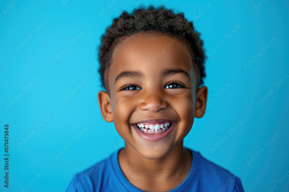 African American little boy looks at the camera and smiles African American little boy looks at the camera and smiles