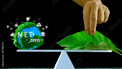 Net zero concept illustrated by a globe with greenery and sustainable development icons balanced against leaves on a scale, symbolizing the balance between carbon emissions and sustainability.