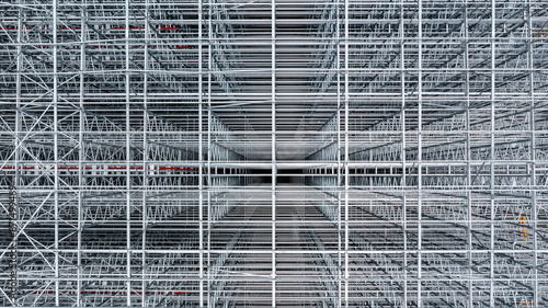 Obraz na plátně Aerial view scaffolding building construction, Scaffolding at construction site, Business investment Scaffolding pipe construction site with scaffold building strength scaffold on construction site