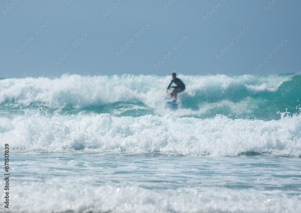 professional surfer riding waves, men catching waves in ocean, isolated. Surfing action water board sport. people water sport lessons and beach swimming activity on summer vacation professional surfer riding waves, men catching waves in ocean, isolated. Surfing action water board sport. people water sport lessons and beach swimming activity on summer vacation