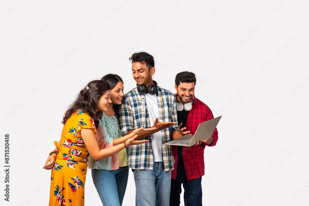 Indian asian college students using laptop isolated against white background Indian asian college students using laptop isolated against white background