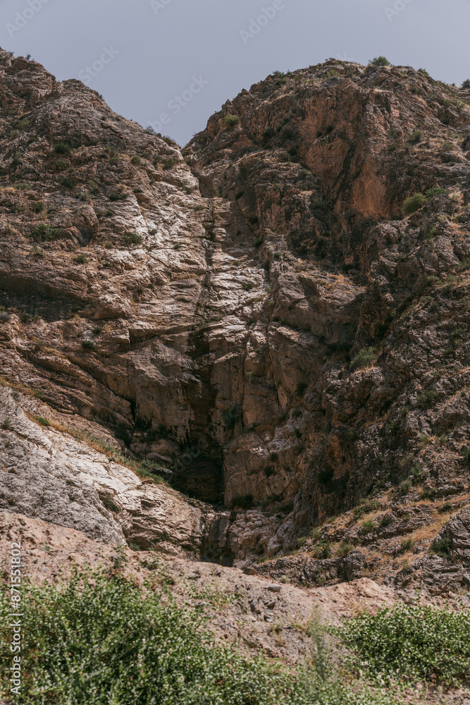 Obraz premium A mountain with a large hole in the middle