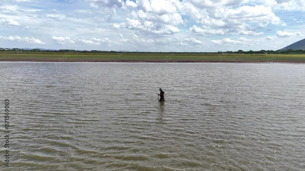 June,27,2024,Lopburi thailand,A fisherman casting fishing net A fisherman casting a fishing net June,27,2024,Lopburi thailand,A fisherman casting fishing net A fisherman casting a fishing net