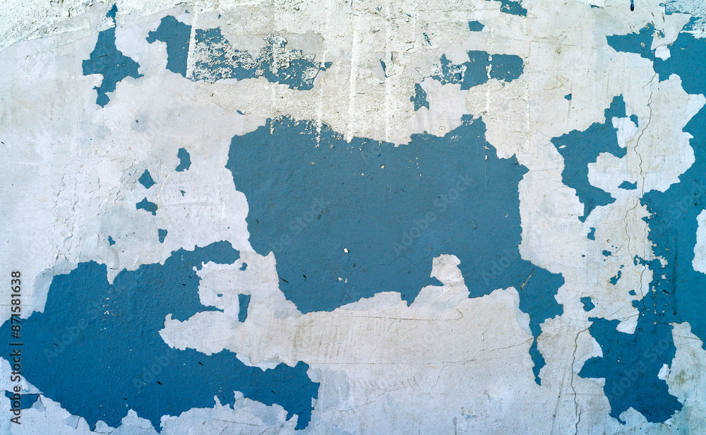 Fototapeta premium Peeling blue white paint on a gray concrete wall texture background