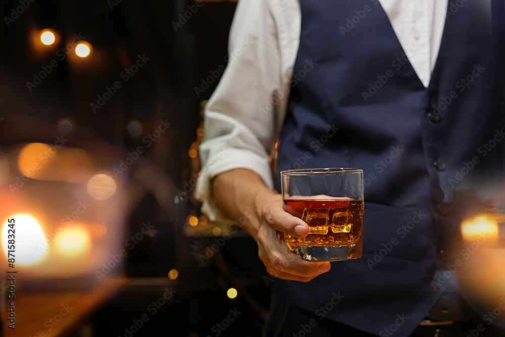 Bartender pouring Whiskey, on bar Bartender pouring Whiskey, on bar