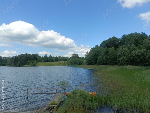 Bubiai lake during sunny day. Lake with small waves. Sunny day with white and gray clouds in sky. Nature. Bubiu ezeras. photo