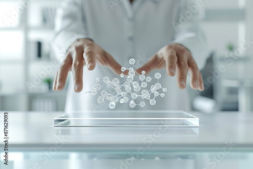 A person is holding up a clear glass table with a bunch of small spheres on it photo