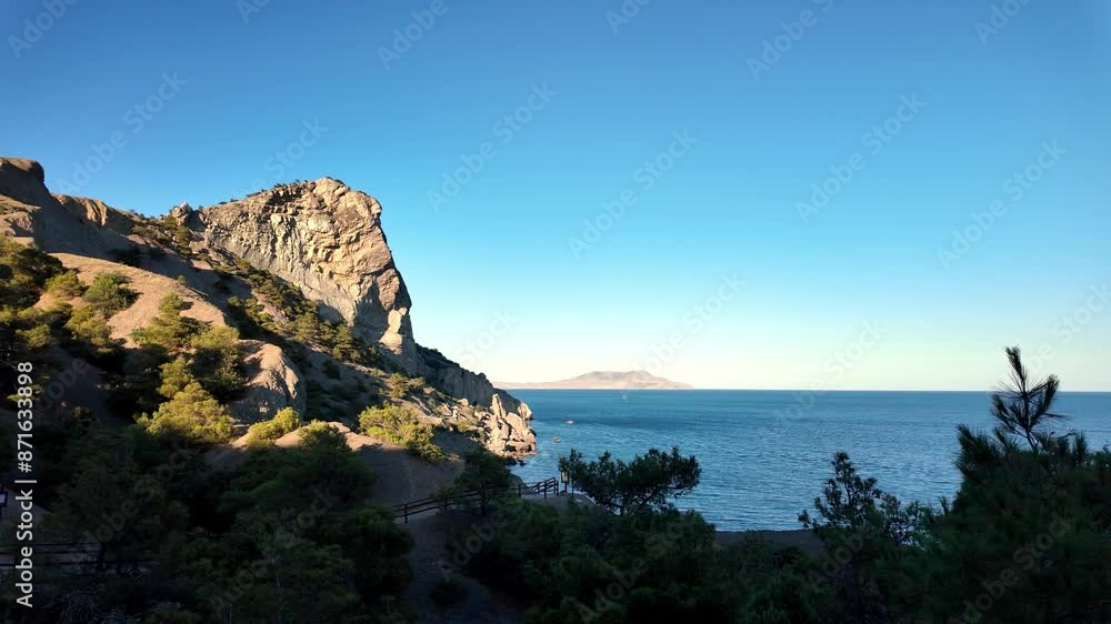 A breathtaking view of the ocean from Juniper Grove, New World, featuring a towering cliff and a small island in the distance. A breathtaking view of the ocean from Juniper Grove, New World, featuring a towering cliff and a small island in the distance.
