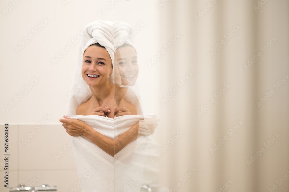 Cute happy young woman after shower looking contented Cute happy young woman after shower looking contented