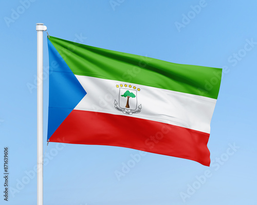 Equatorial Guinea flag on stick on sky background. Realistic flag illustration photo