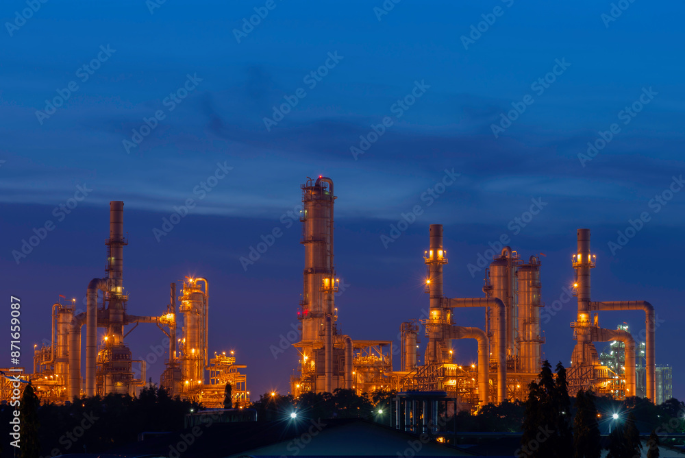 Gas turbine electrical power plant at dusk with orange sky Gas turbine electrical power plant at dusk with orange sky