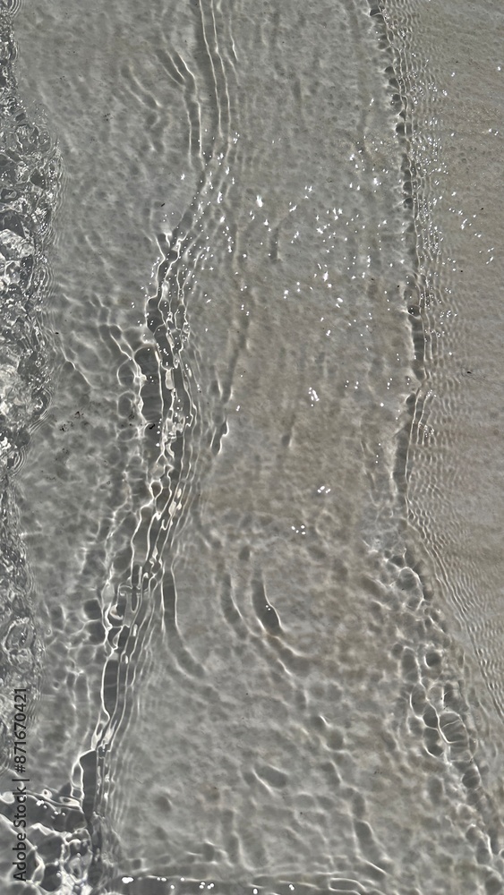 Defocused liquid clear water surface texture with splashes bubbles with copy space. Water waves in sunlight background.
Trendy summer nature banner. Defocused liquid clear water surface texture with splashes bubbles with copy space. Water waves in sunlight background.
Trendy summer nature banner.