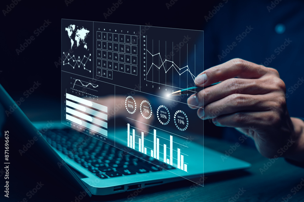 Businessman using computer for development and Analytics Data technology management System for report marketing strategy planning. graph analysis and information on a futuristic virtual screen. Businessman using computer for development and Analytics Data technology management System for report marketing strategy planning. graph analysis and information on a futuristic virtual screen.