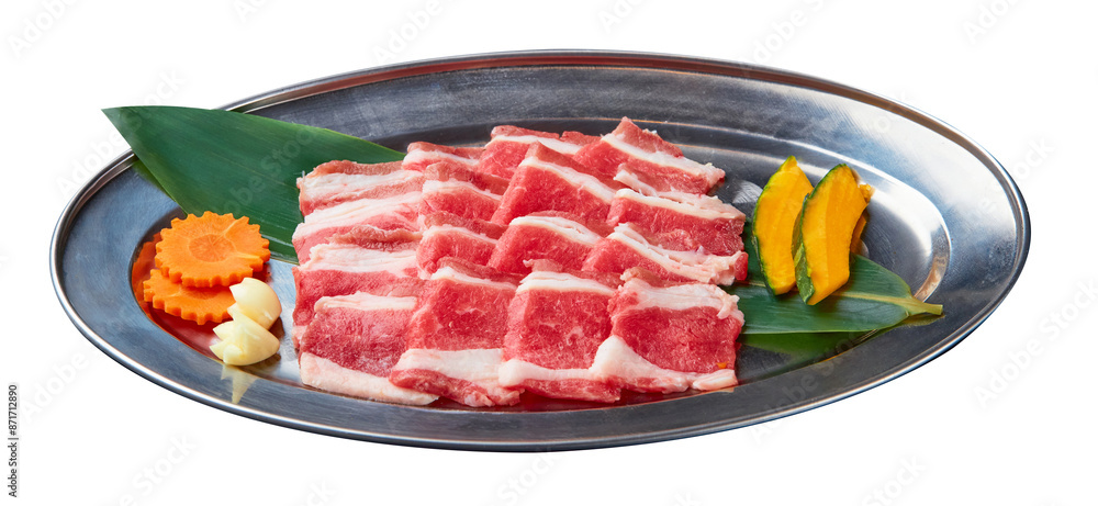Φωτογραφία Sliced Beef is beautifully arranged with a set of vegetables (Sliced pumpkin, garlic and carrots) served on a stainless steel tray isolated on white background
