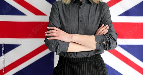 Wallpaper Mural Woman crossing her arms on background of uk flag closeup 4k movie slow motion. English classes concept Torontodigital.ca
