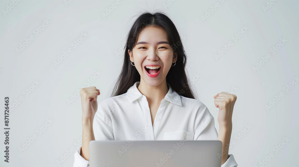 beauty Asian woman happy and rise fist hand with laptop, isolated on white background beauty Asian woman happy and rise fist hand with laptop, isolated on white background