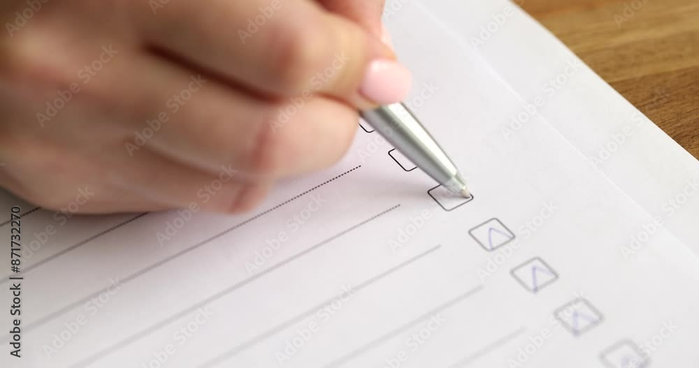 Hand ticking ballpoint pen in paper questionnaire closeup 4k movie slow motion. University entrance exam testing concept Hand ticking ballpoint pen in paper questionnaire closeup 4k movie slow motion. University entrance exam testing concept