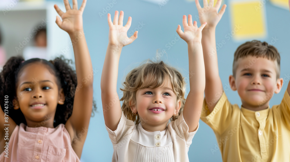 Multicultural kids raising their hands to answer a question or play at school Multicultural kids raising their hands to answer a question or play at school