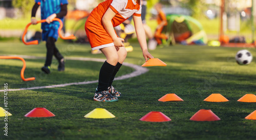 Foto Little Boy Pick Up Training Cones on Training Game