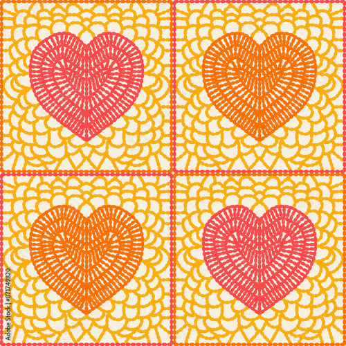 Granny squares with crocheted pink and orange hearts on yellow