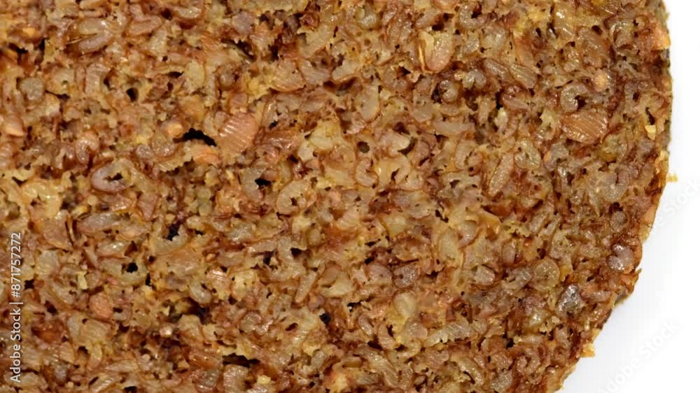 Whole grain bread on a turn table, macro view Whole grain bread on a turn table, macro view