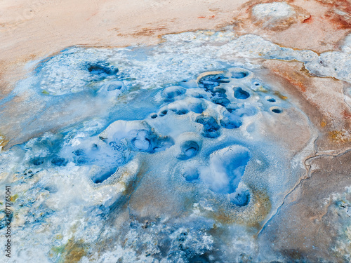Obraz na płótnie View from above, stunning aerial view of Námafjall Geothermal Area also known as Hverir with smoking fumaroles and boiling mud pots, surrounded by sulphur crystals of many different colours, Iceland. w salonie