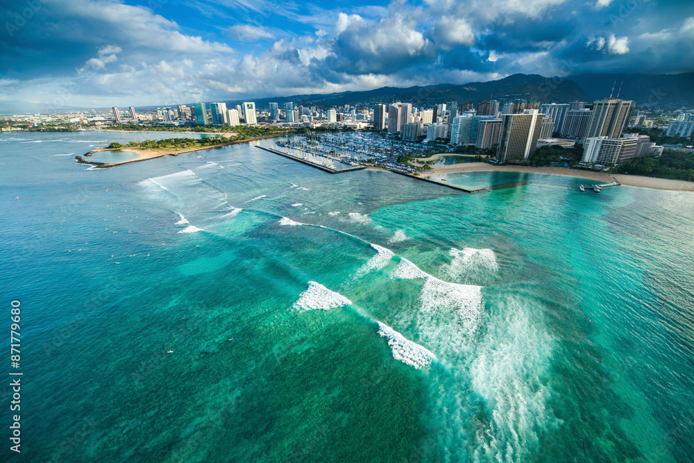 Aerial view of Waikiki Beach and skyline with ocean waves, Honolulu, Hawaii, United States. Aerial view of Waikiki Beach and skyline with ocean waves, Honolulu, Hawaii, United States.