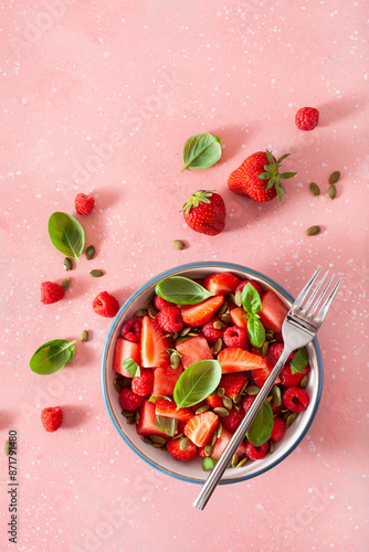 Obraz na płótnie watermelon salad with strawberry raspberry basil seeds. healthy summer dessert w salonie