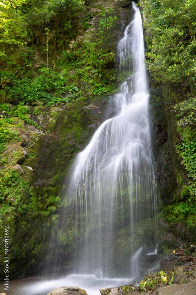waterfall, rocks, river falls from a cliff, water flow, spring in the mountains waterfall, rocks, river falls from a cliff, water flow, spring in the mountains