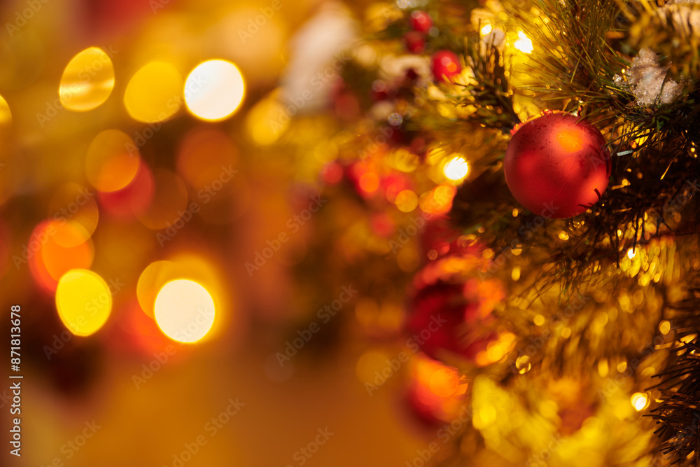New Year christmas tree decorated Christmas balls with yellow flickering lights of garlands on green tree at night, merry Christmas and happy New Year mood with twinkling lights New Year christmas tree decorated Christmas balls with yellow flickering lights of garlands on green tree at night, merry Christmas and happy New Year mood with twinkling lights