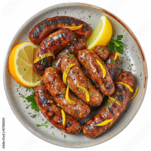 A plate of Greek loukaniko, grilled sausage flavored with orange zest and spices, served with a side of lemon wedges, isolated on white background. photo