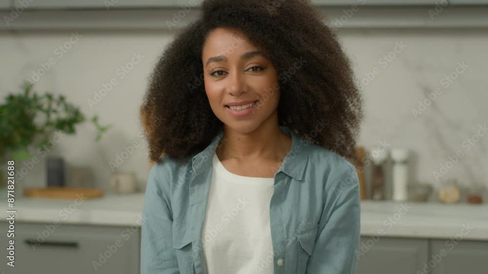 Portrait African American happy smiling girl carefree smile toothy health white oral healthy teeth positive woman ethnic female cheerful lady housewife at kitchen own rental home looking at camera Portrait African American happy smiling girl carefree smile toothy health white oral healthy teeth positive woman ethnic female cheerful lady housewife at kitchen own rental home looking at camera